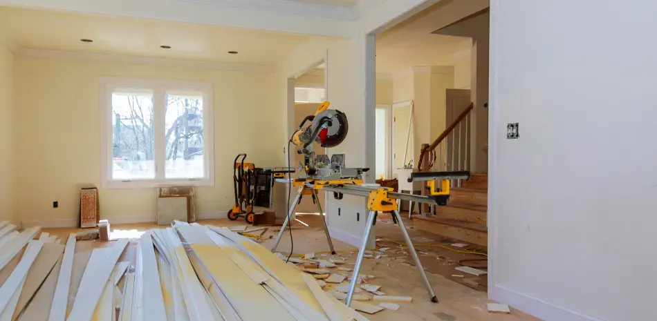 Interior renovation in progress with fresh trim and flooring materials staged in the room