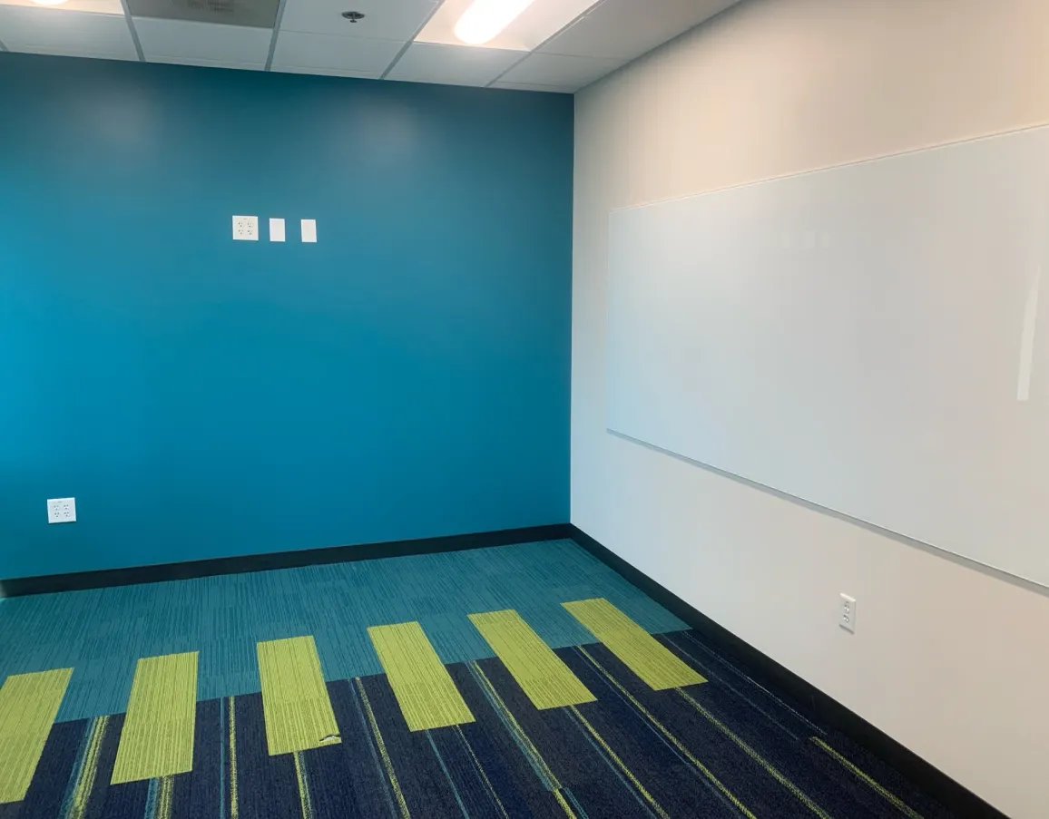 Freshly painted interior wall with a bold teal accent color